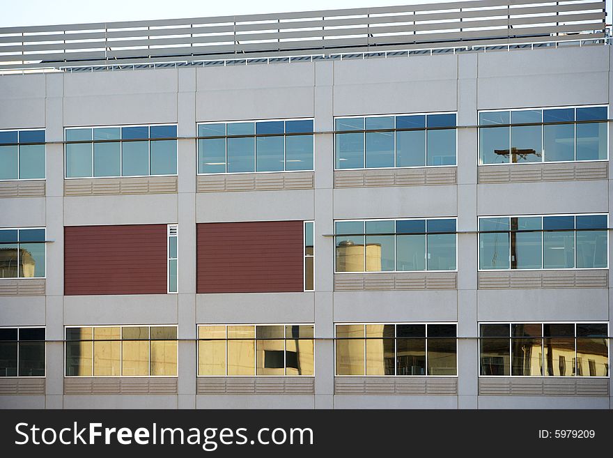 An office building with a empty parking lot