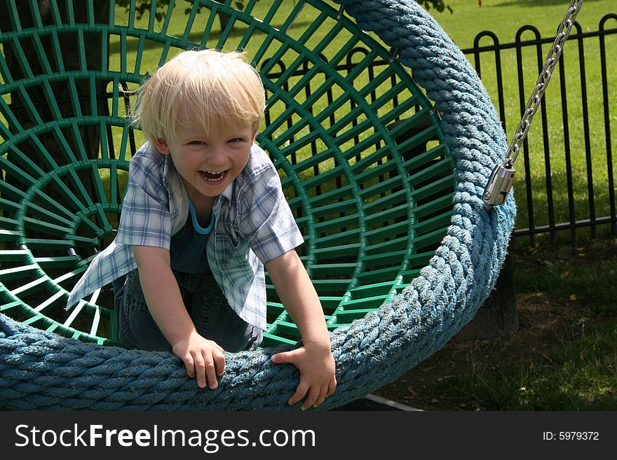 Small boy on the swing. Small boy on the swing