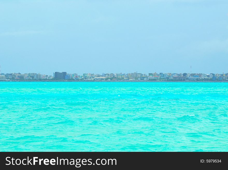 Island of Paradise. White sand beaches with coco-tree and crystal blue water. Maldives. Luxury holidays. Island of Paradise. White sand beaches with coco-tree and crystal blue water. Maldives. Luxury holidays.