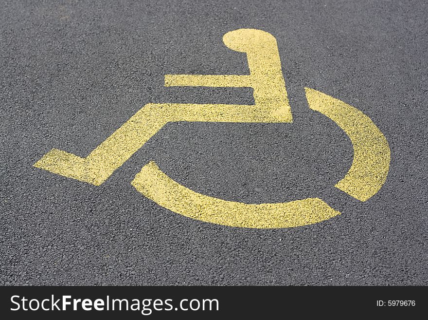 Yellow parking sign for handicapped people