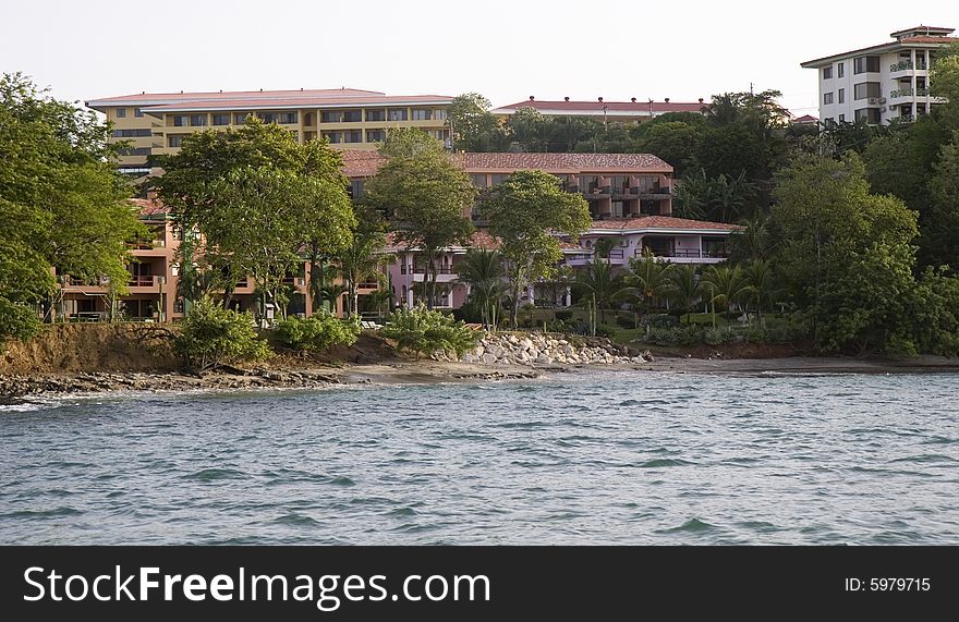 A beautiful resort of pink stucco rising out of the sea. A beautiful resort of pink stucco rising out of the sea