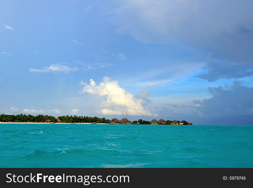 Island of Paradise. White sand beaches with coco-tree and crystal blue water. Maldives. Luxury holidays. Island of Paradise. White sand beaches with coco-tree and crystal blue water. Maldives. Luxury holidays.