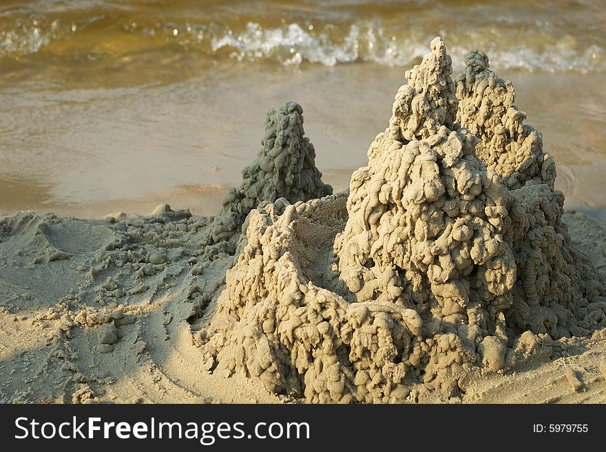 A little sandcastle on a beach