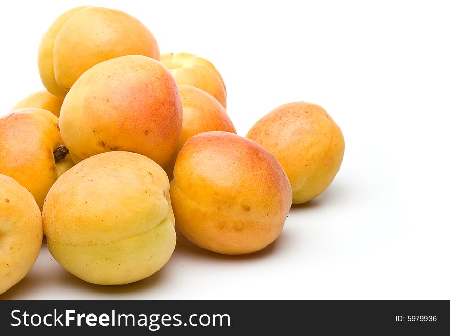 Fresh appetizing apricots on a white background. Fresh appetizing apricots on a white background