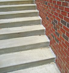 Cement Staircase Against Brick Wall Royalty Free Stock Photos