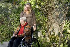 Woman With Mother In Garden - Horizontal Royalty Free Stock Photography Woman With Mother In Garden - Horizontal Royalty Free Stock Photography