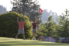 Man And Woman On Golf Course - Horizontal Royalty Free Stock Photos