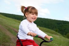 Girl Riding A Bicycle Stock Photography