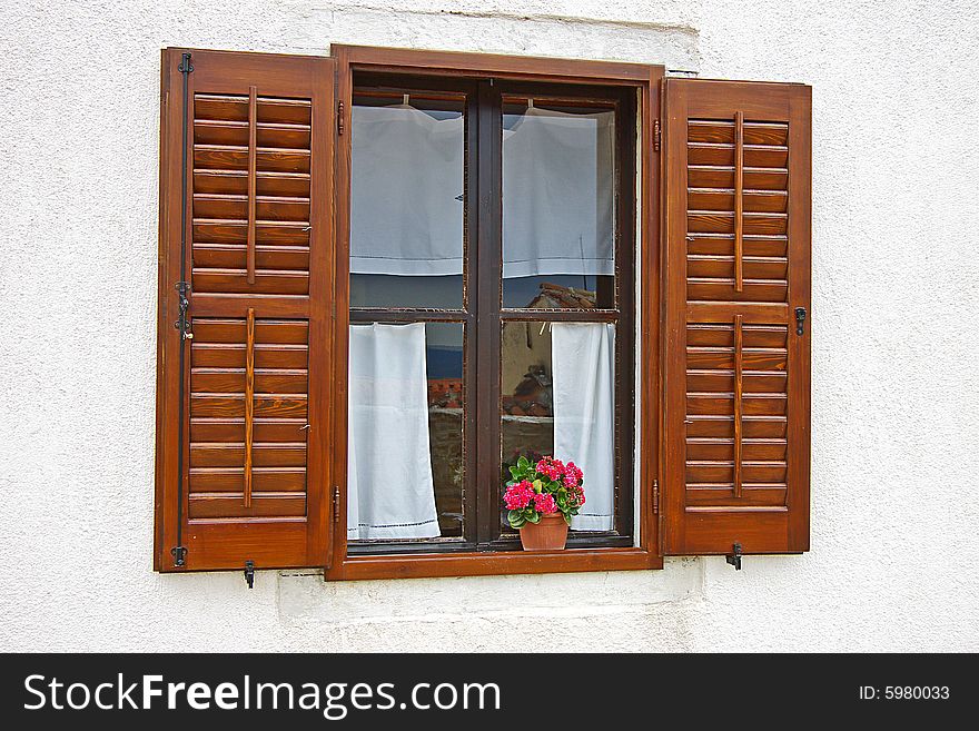 On a photo window with colors on a window sill