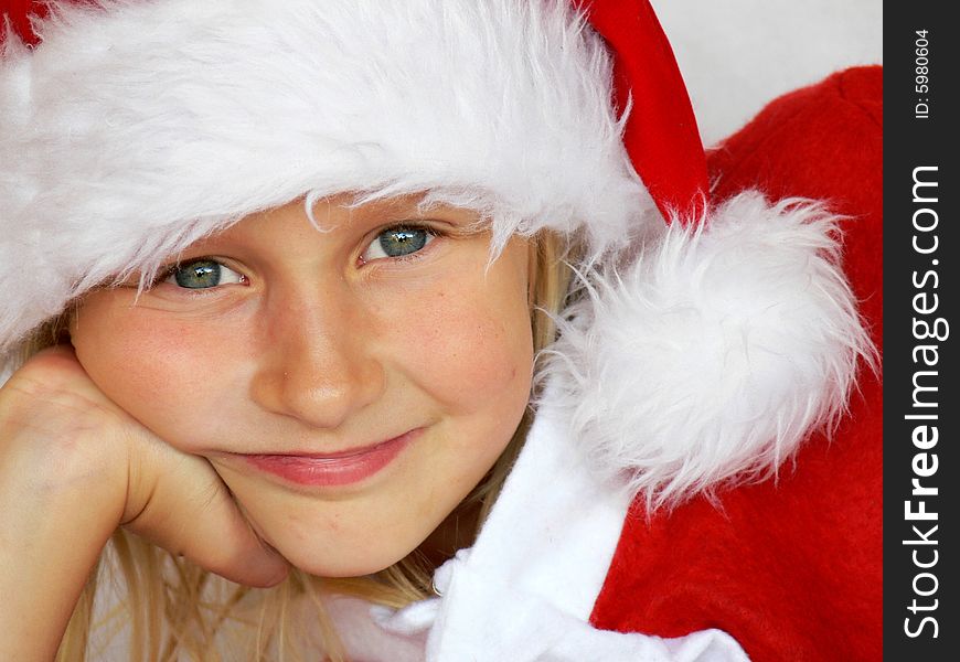 Smiling Girl In Santa Hat