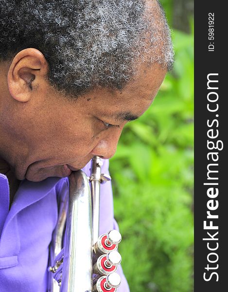 Portrait of a african american jazz trumpet/flugelhorn player. Portrait of a african american jazz trumpet/flugelhorn player.