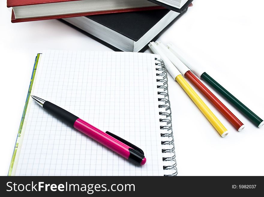 Pencils, books and notebooks on a white background. Pencils, books and notebooks on a white background