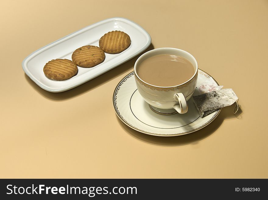 Cup of tea, tea bag and cookies. Cup of tea, tea bag and cookies
