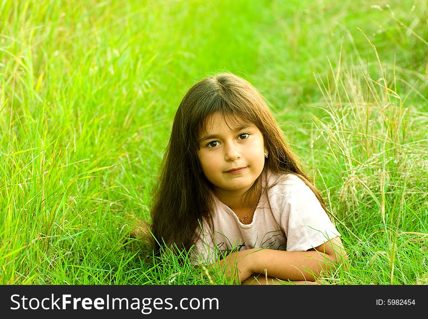 A shot of little girl on grass