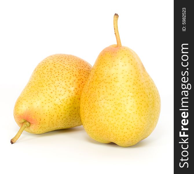 Two yellow pears on a white background. Two yellow pears on a white background