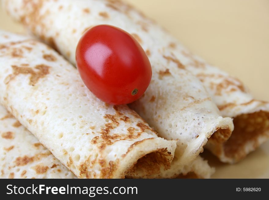 Close up of pancakes on a yellow plate. Close up of pancakes on a yellow plate