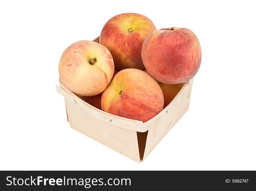 Fresh tasty peaches in a wood pint box. Fresh tasty peaches in a wood pint box
