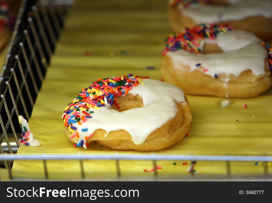 Glazed Donuts with Sprinkles in a Basket