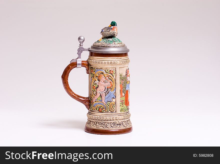 A colorful ceramic beer stein from Austria or Germany. A colorful ceramic beer stein from Austria or Germany