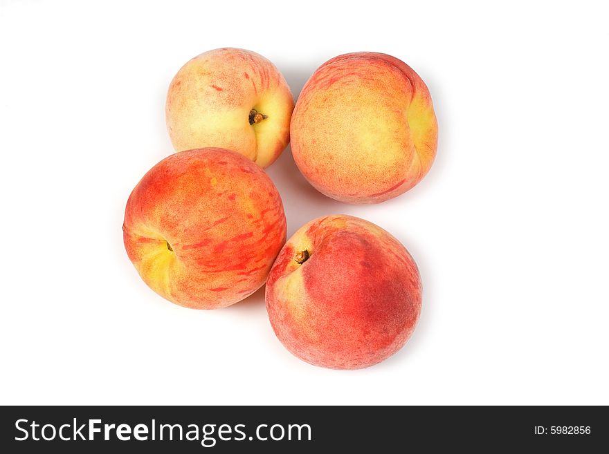 Four fresh tasty peaches on white background. Four fresh tasty peaches on white background