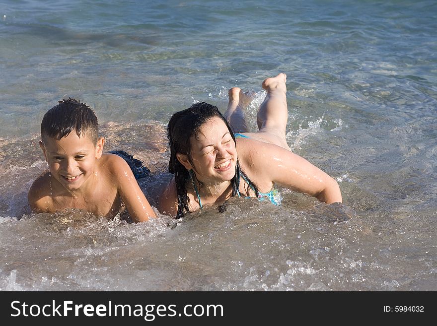 Woman And Boy On The Beach