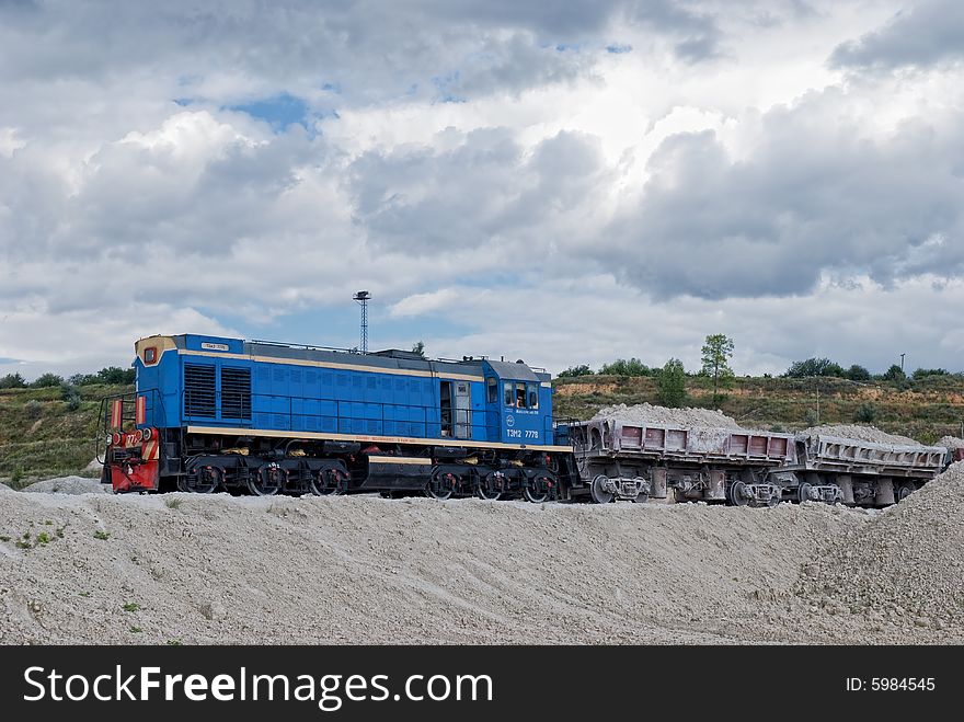 Loaded train. Industrial area. Transportation.