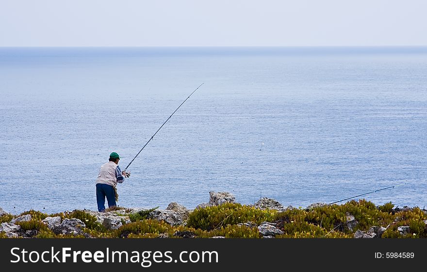 Retired man enjoying a fishing day. Retired man enjoying a fishing day.