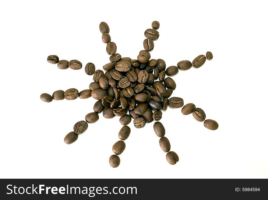 Coffee beans in sun shape on white background. Coffee beans in sun shape on white background