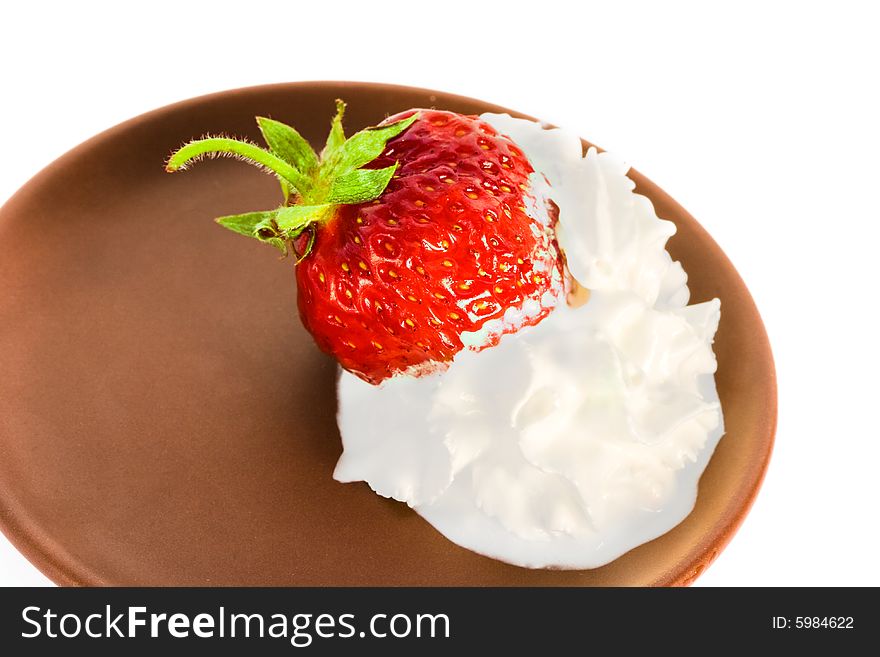 Strawberry on plate over white background