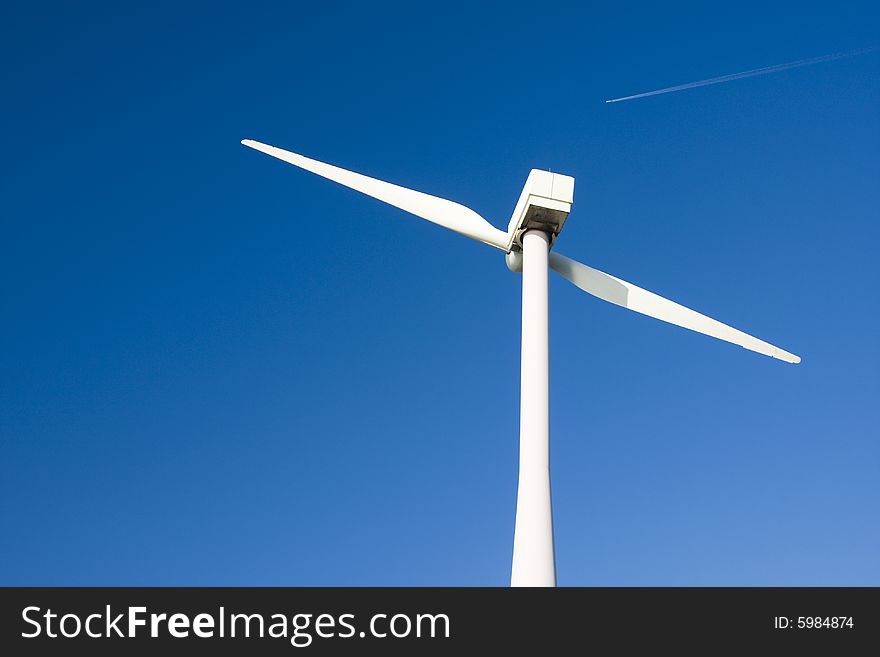 Two Bladed Windmill Against a Blue Sky