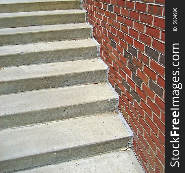 Cement Staircase Against Brick Wall