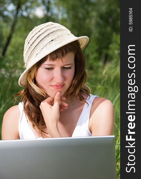 Thoughtful girl with a notebook outdoor