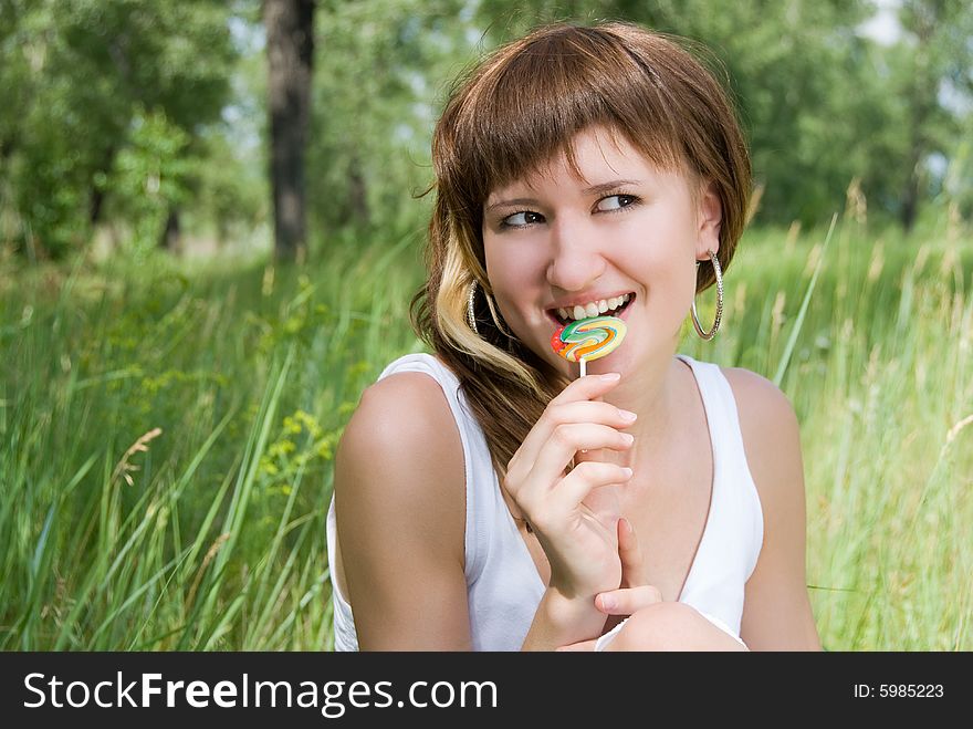 Pretty girl with a lollipop outdoor. Pretty girl with a lollipop outdoor