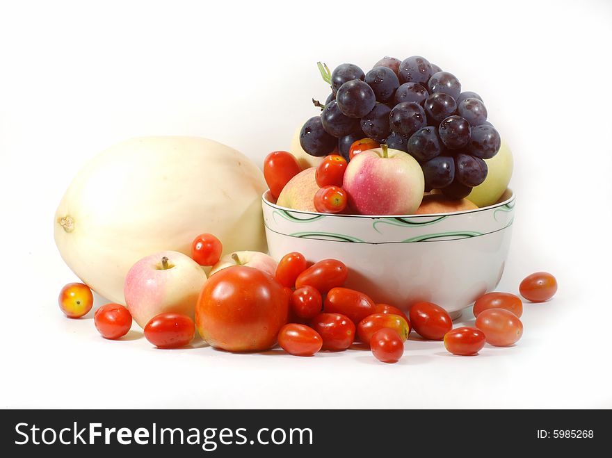 Apples,grapes, cantaloup and tomato on white background. Apples,grapes, cantaloup and tomato on white background