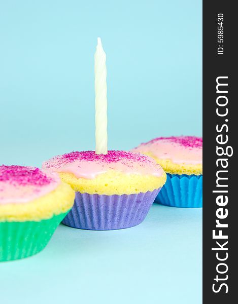 Cup cakes isolated against a blue background