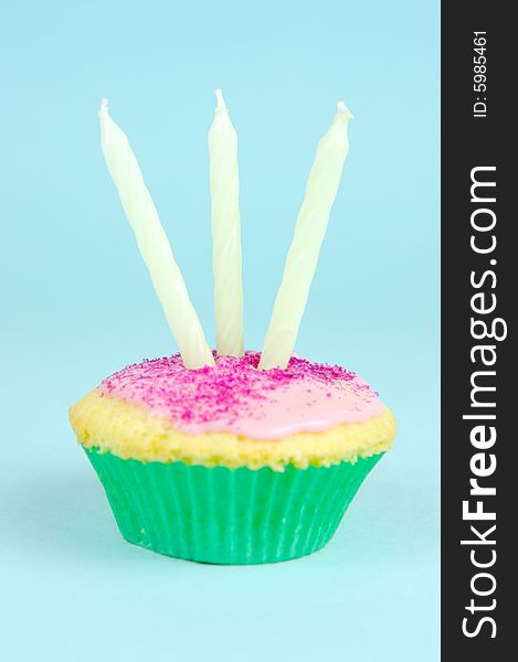 Cup cakes isolated against a blue background