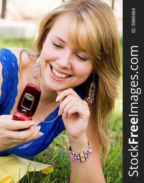 Pretty girl with a cell-phone outdoor
