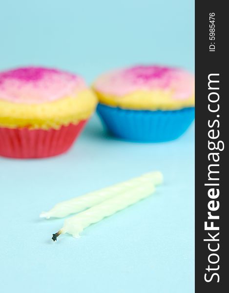 Cup cakes isolated against a blue background