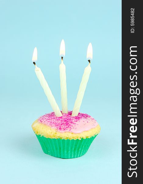 Cup cakes isolated against a blue background