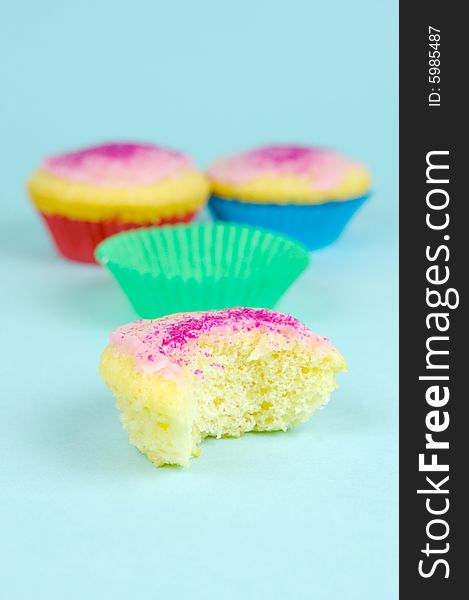 Cup cakes isolated against a blue background