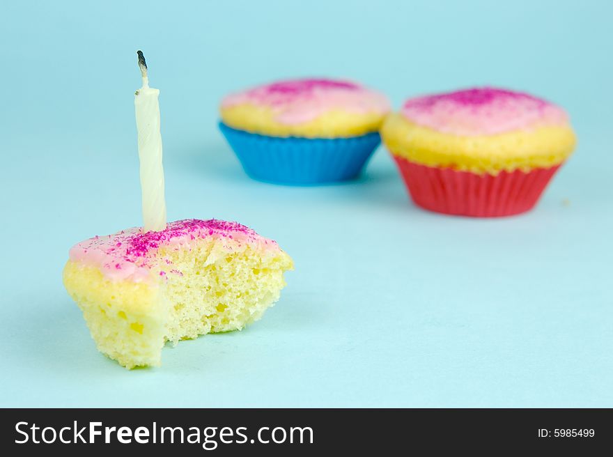 Cup cakes isolated against a blue background