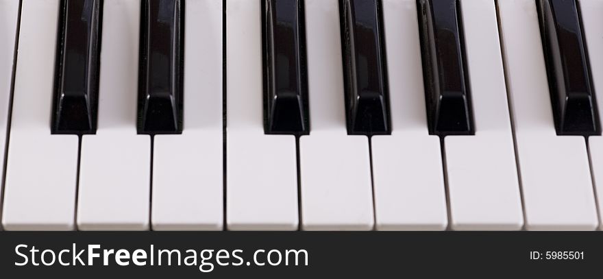 Keyboard of synthesizer close up of an octave of keys. Keyboard of synthesizer close up of an octave of keys.