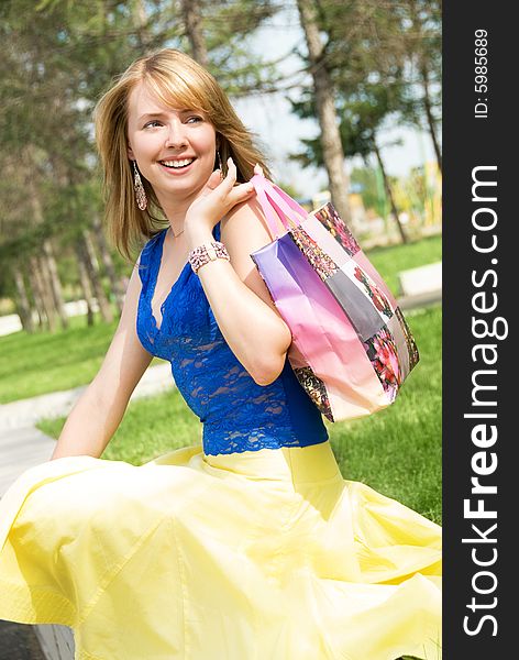 Happy Girl With A Shopping Bag