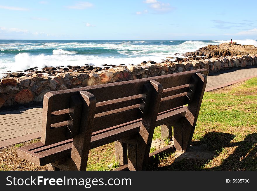 Wooden Bench By The Sea