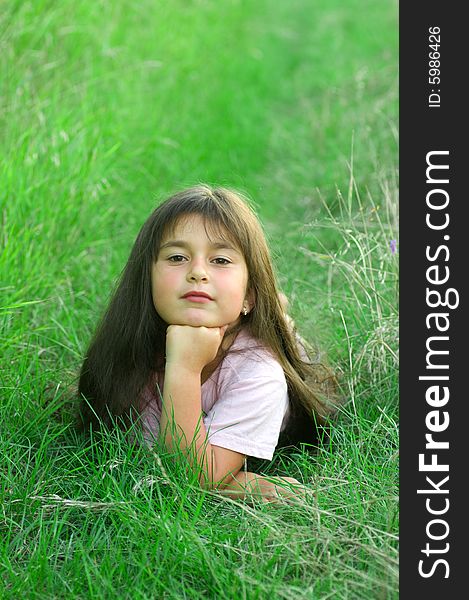 A shot of little girl on grass