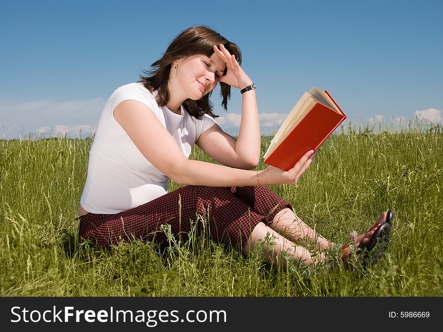 Girl Reading A Book Outdoor