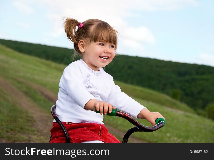 Girl Riding A Bicycle