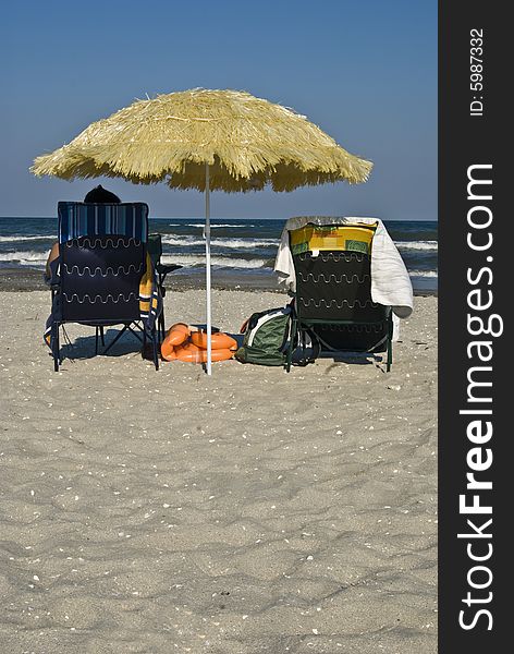 Yellow reed umbrella on Black Sea beach. Yellow reed umbrella on Black Sea beach