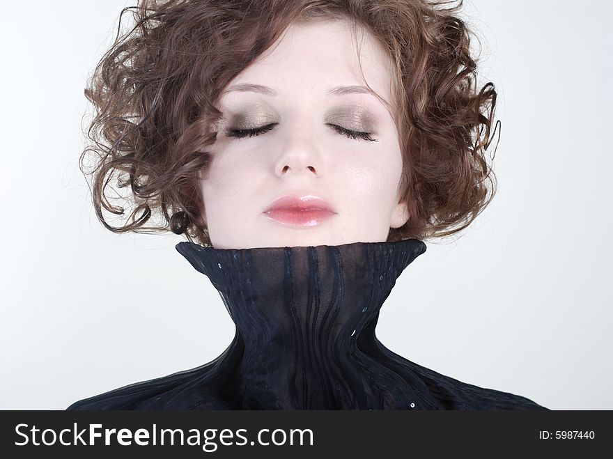 Beauty portrait of young woman with closed eyes at white background. Beauty portrait of young woman with closed eyes at white background