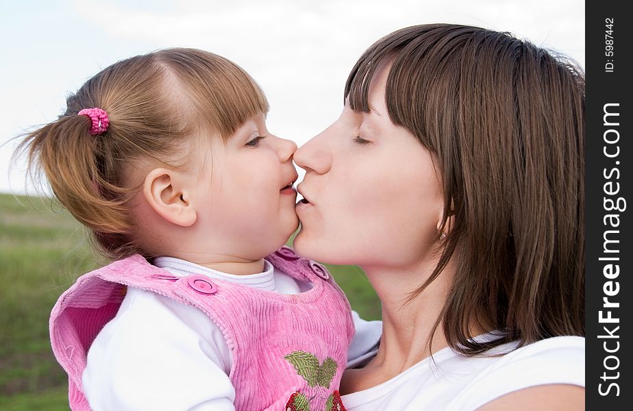 Loving mother and her little daughter outdoor. Loving mother and her little daughter outdoor